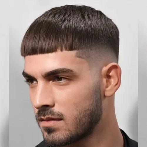A timeless classic French crop with a straight fringe and faded sides, offering a clean, sophisticated style.